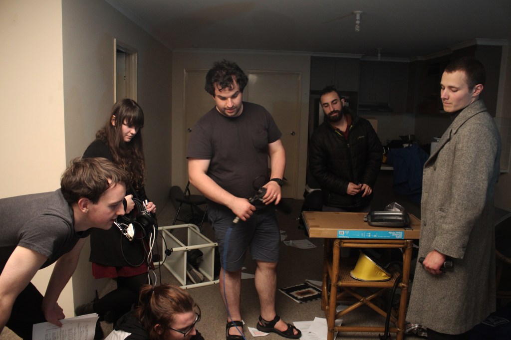 The cast and crew during a shoot of The Agent Killer. Someone spilt fake blood. 