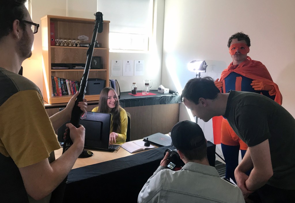 Behind the scenes of Uni Man in Vernon's office